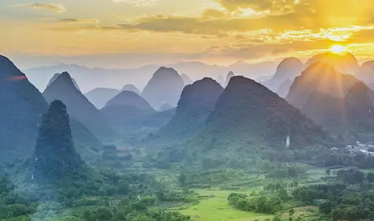 Sun shining over the hills of Guilin, China