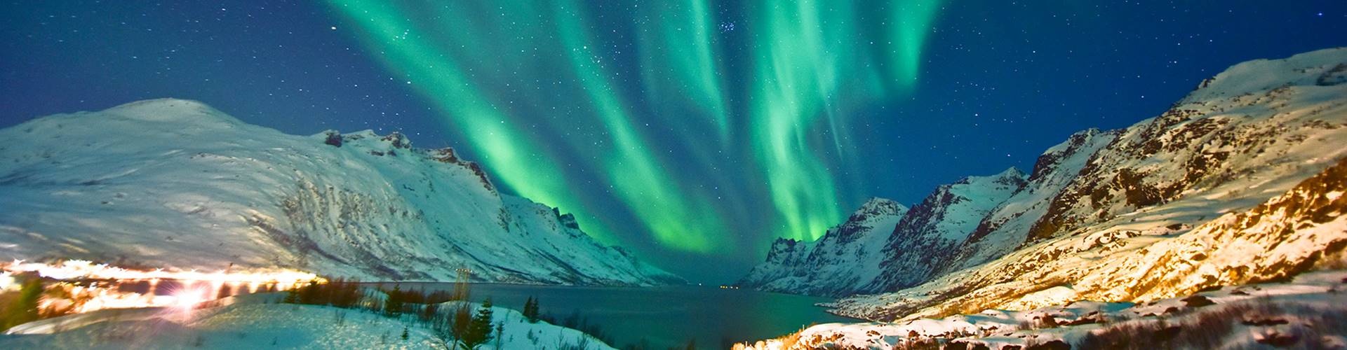 Northern Lights over snowy mountains, Norway